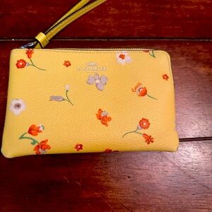 Yellow flowered Coach Wristlet